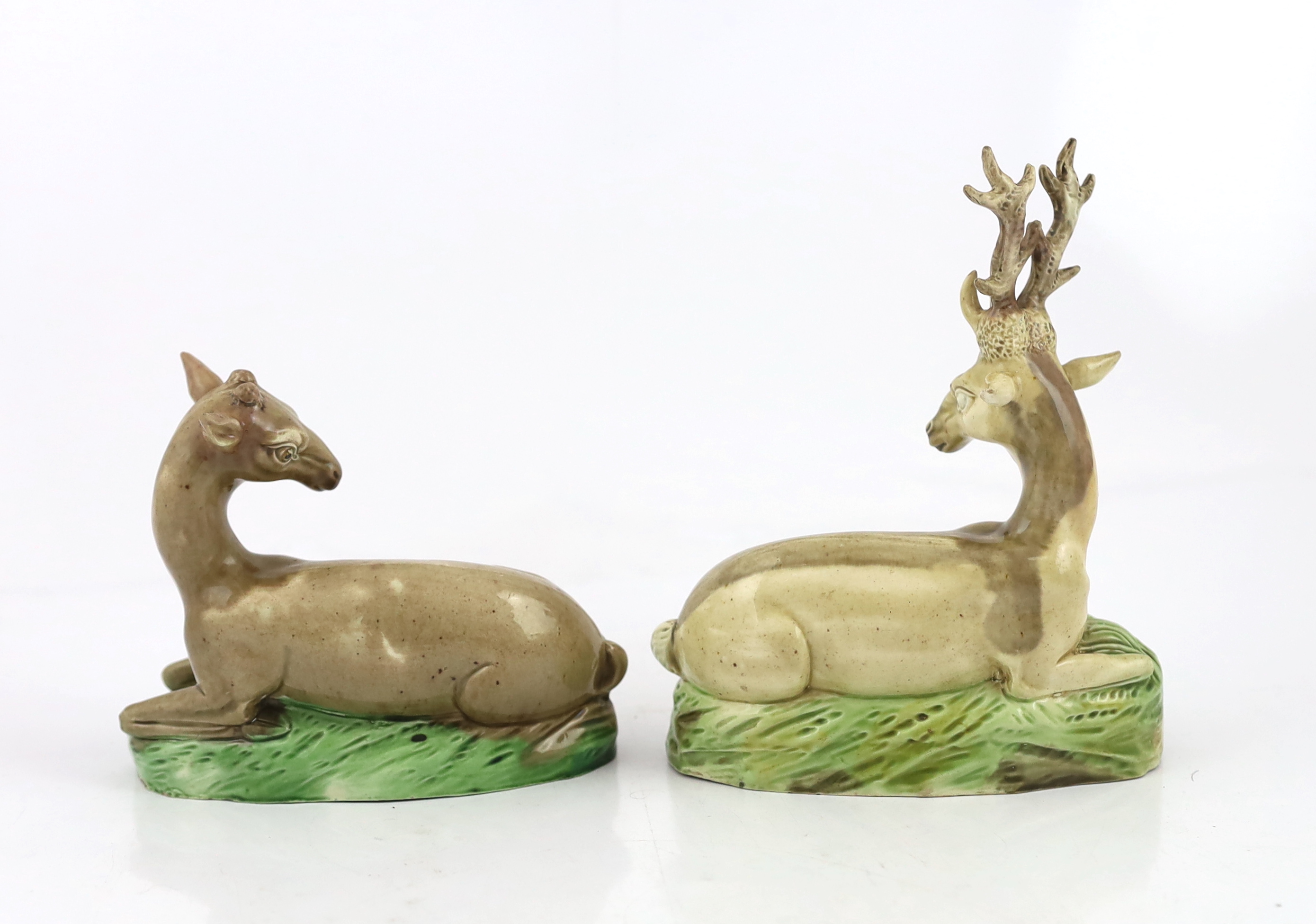 A near pair of Ralph Wood type figures of a Stag and Hind, c.1790, some restoration